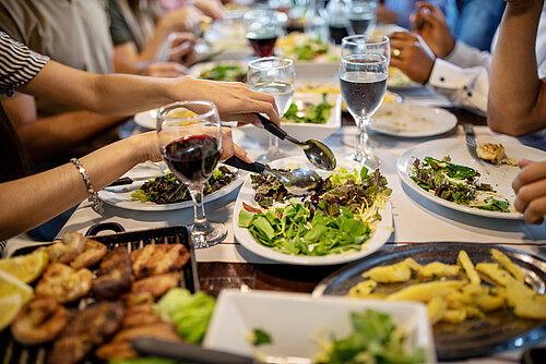 Food and wine on the restaurant table for family lunch