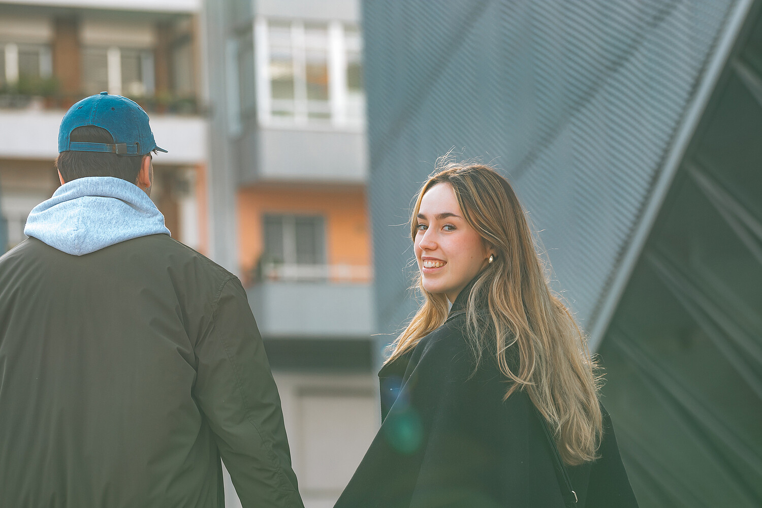 couple of boy and girl on the street outdoors hugging